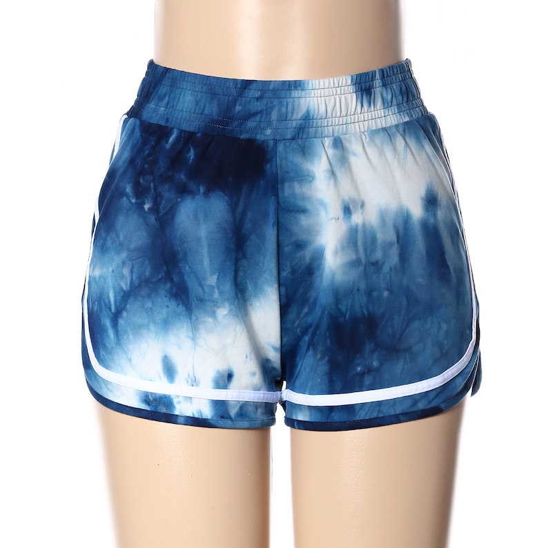 May include: Blue and white tie-dye shorts with white trim. The shorts have an elastic waistband.