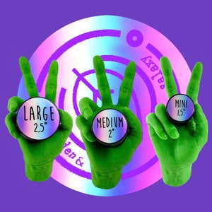 May include: Three green hands in peace signs hold round, iridescent objects labelled "LARGE 2.5", "MEDIUM 2", and "MINI 1.5". The background has a purple and iridescent design with the words "Galaxy Garden &" visible.