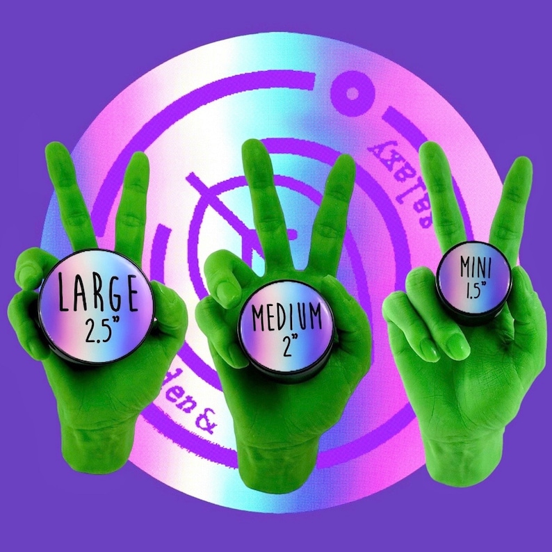 May include: Three green hands holding different sized ear gauges. The gauges are black with iridescent purple and blue accents. The gauges are labeled "Large 2.5", "Medium 2", and "Mini 1.5".