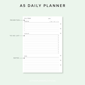 May include: A5 daily planner printable with sections for priorities, to do list, and notes. The planner has a simple design with black text and lines on a white background.