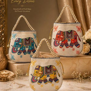 May include: Three handcrafted potli bags with elephant designs. Each bag features intricate embroidery and pearl detailing. The elephants are in blue, red, and yellow, with floral accents. The bags have pearl handles and are designed for every occasion.