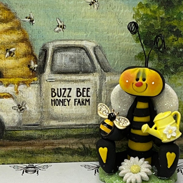 Clay bee, bee decor, tiered tray decor, Rae Dunn displays, clay figures, watering can decor, tiered tray decor.
