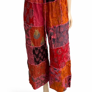 May include: A handmade wooden sign with the text "Welcome to our home" in a handwritten style. The sign is painted white with black lettering and a distressed finish, perfect for home decor.