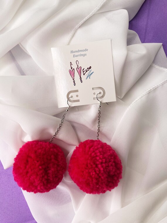 Big pom pom earrings clearance