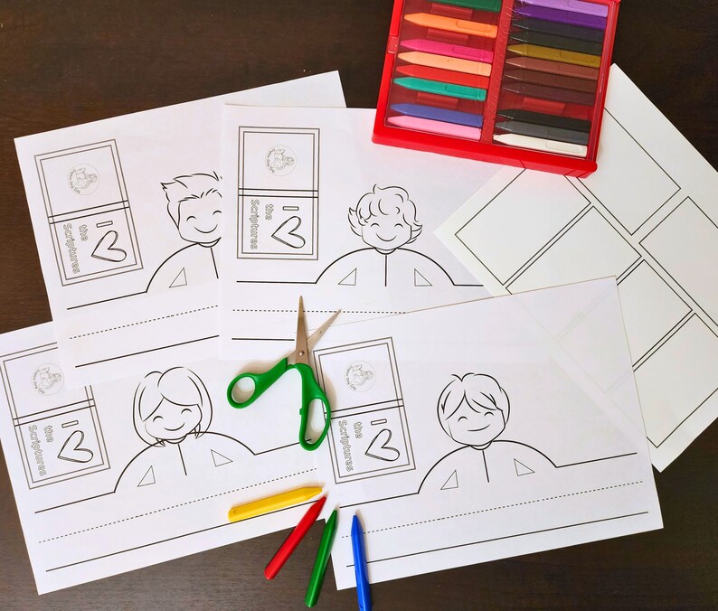 May include: A set of printable paper crowns featuring children holding books with the text "I love the Scriptures". The crowns are designed for coloring and cutting out. The image also includes a set of colored pencils and a pair of scissors.