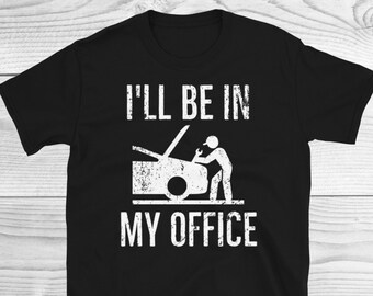 May include: Black t-shirt with white text that reads "I'll be in my office" and a graphic of a person working on a car.