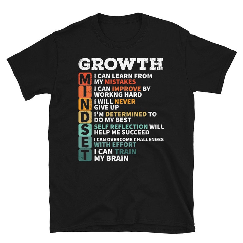 May include: Black t-shirt with a vintage-style graphic that reads "GROWTH MINDSET" and lists a series of positive affirmations about personal growth.