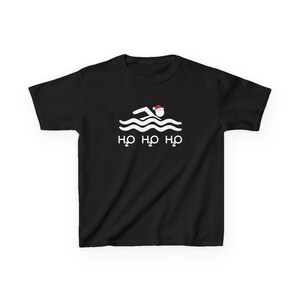 May include: A black short-sleeved t-shirt featuring a white graphic of a stick figure swimmer wearing a red and white Santa hat above wavy lines. Below the swimmer, the text H2O H2O H2O is printed in white, mimicking the sound of laughter.