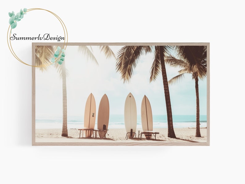 May include: Four surfboards leaning against a wooden bench on a sandy beach with palm trees in the background. The sky is blue and the ocean is turquoise.