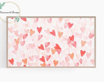 May include: A framed print with a white background and a pattern of pink, red, and orange hearts.