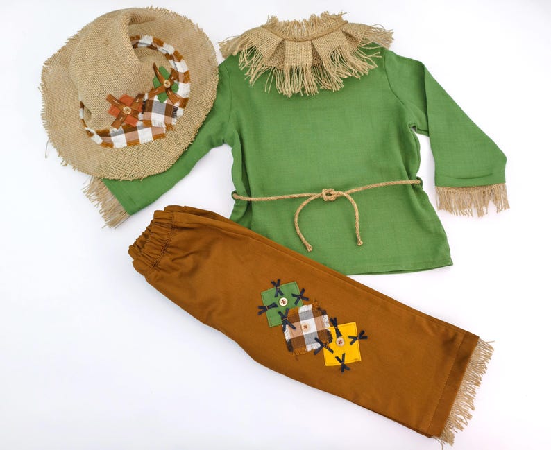 Handmade scarecrow costume for babies and toddlers, perfect for Halloween or fall photo shoots. Features soft cotton fabric, patchwork details, and rustic charm. Ages newborn to 10 years.