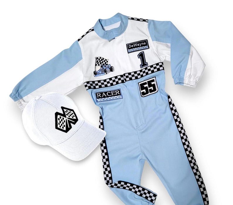 May include: A blue and white racing jumpsuit with black checkered accents. The jumpsuit has the name "DeWayne" and the number "55" on it. It also has a small race car graphic and the word "RACER". A white baseball cap with a black checkered flag graphic is included.