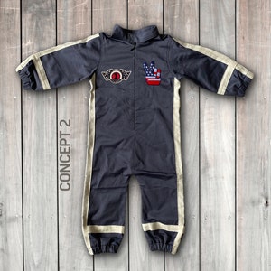 May include: A dark gray jumpsuit with white stripes down the sides. The jumpsuit has a zipper in the front and a patch on the chest with a number 1 and wings. There is also a patch on the right side with a peace sign and an American flag.
