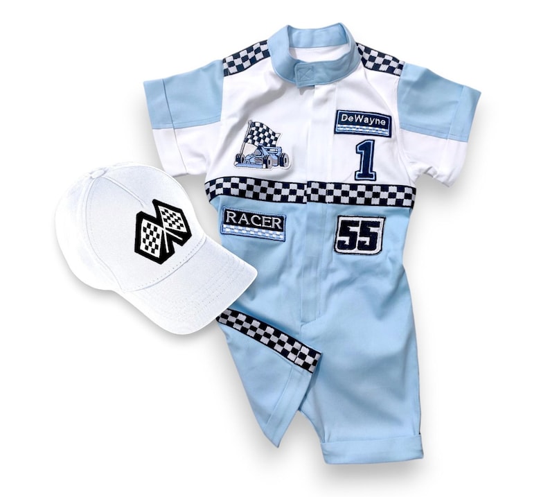 May include: A blue and white racing suit with a checkered pattern and the name "DeWayne" and the number "1" on the front. The suit also has the number "55" on the front and the word "RACER" on the chest. A white baseball cap with a checkered flag design is included.