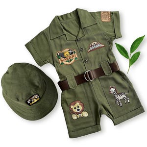 Front view of the long-sleeved safari costume set including a standard olive green bucket hat without ears. Features multiple animal patches like a lion and zebra, along with a brown belt, making it a perfect scout outfit for boys and girls.