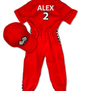 Formula 1 inspired red racing jumpsuit for kids – features checkered flag patches, race car embroidery, and “Racer” badge on the chest. Complete with adjustable red cap. Customizable with name and favorite number on the back. Ideal for parties and play.
