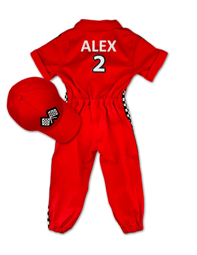 Formula 1 inspired red racing jumpsuit for kids – features checkered flag patches, race car embroidery, and “Racer” badge on the chest. Complete with adjustable red cap. Customizable with name and favorite number on the back. Ideal for parties and play.