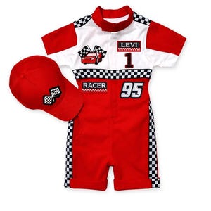 May include: A red and white racing-themed outfit for a child, including a short-sleeved jumpsuit and a baseball cap. The jumpsuit features a checkered flag design, the word "RACER", the number "95", and the name "LEVI". The cap has a checkered flag patch.