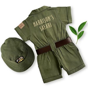Back view of the kids' safari jumpsuit showcasing "Harrison's Safari" embroidered in a cream-colored font. This high-quality cotton adventurer outfit is designed for personalized birthday gifts, photoshoots, and toddler explorer play sessions.