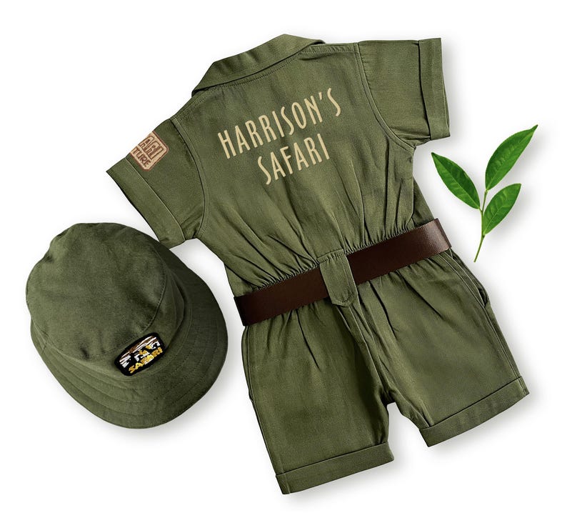 Back view of the kids' safari jumpsuit showcasing "Harrison's Safari" embroidered in a cream-colored font. This high-quality cotton adventurer outfit is designed for personalized birthday gifts, photoshoots, and toddler explorer play sessions.