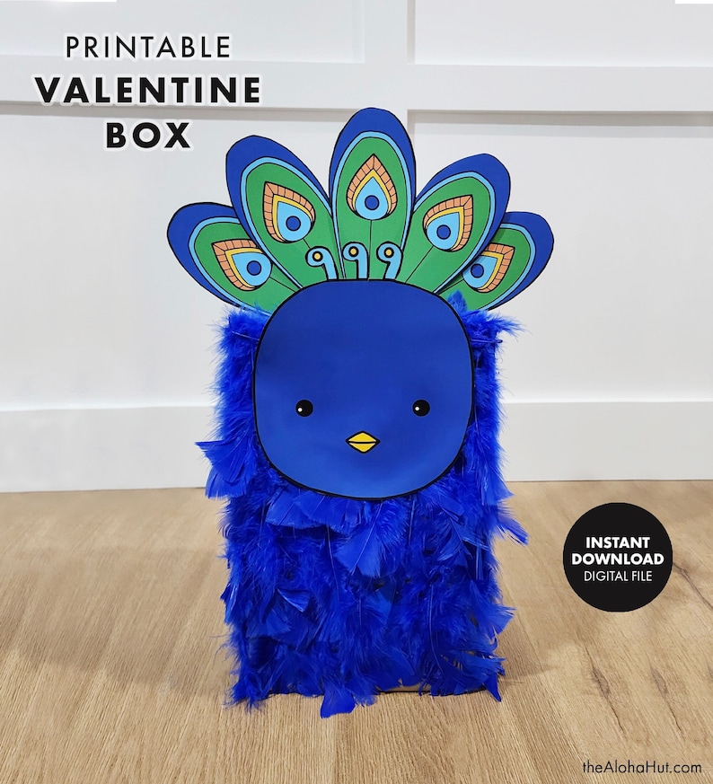 May include: Printable Valentine box with a peacock design. The box is blue with a blue and green peacock feather design on top. The box has a cute cartoon face with a yellow beak and black eyes. The text 'PRINTABLE VALENTINE BOX' is at the top of the image. The text 'INSTANT DOWNLOAD DIGITAL FILE' is in a black circle at the bottom right of the image.