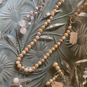 Hand knotted freshwater pearl necklace in pink and gray.