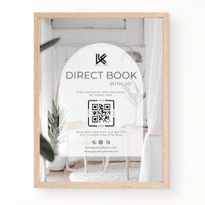 Puede incluir: Un póster enmarcado con fondo blanco y un código QR en blanco y negro. El póster anuncia la reserva directa con tarifas y ventajas exclusivas. El texto "DIRECT BOOK WITH US!" está en una fuente negra sin serifas. El texto "Enjoy exclusive rates and perks. No hidden fees." está en una fuente negra sin serifas más pequeña. El texto "Book your next stay and get 30% OFF, Limited time offer only" está en una fuente negra sin serifas más pequeña. El texto "hello@peacehavensite.com www.peacehavensite.com" está en una fuente negra sin serifas más pequeña.