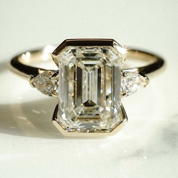 3CT Emerald Cut Engagement Ring ,Clutch Setting And Pear Side Stones 14k Gold Ring ,Trilogy Ring Anniversary Gift ,Unique Ring For Women.