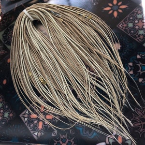 A set of dreadlocks. Blonde shades. Smooth blonde dreadlocks, hair extensions.video tutorials and diagrams on styling kitsViking  set