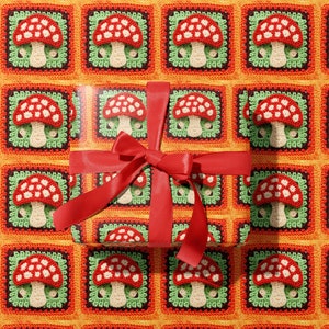 May include: Red and white crocheted mushroom pattern gift wrap with a red satin ribbon bow.