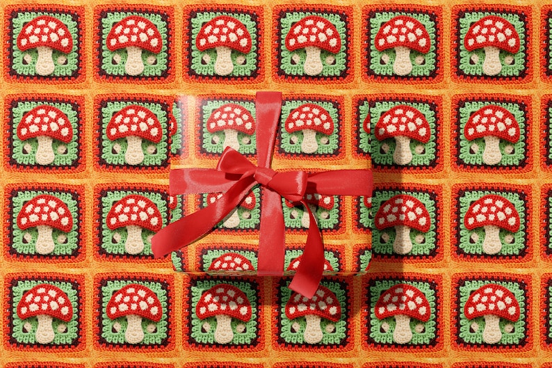 May include: Red and white crocheted mushroom pattern gift wrap with a red satin ribbon bow.