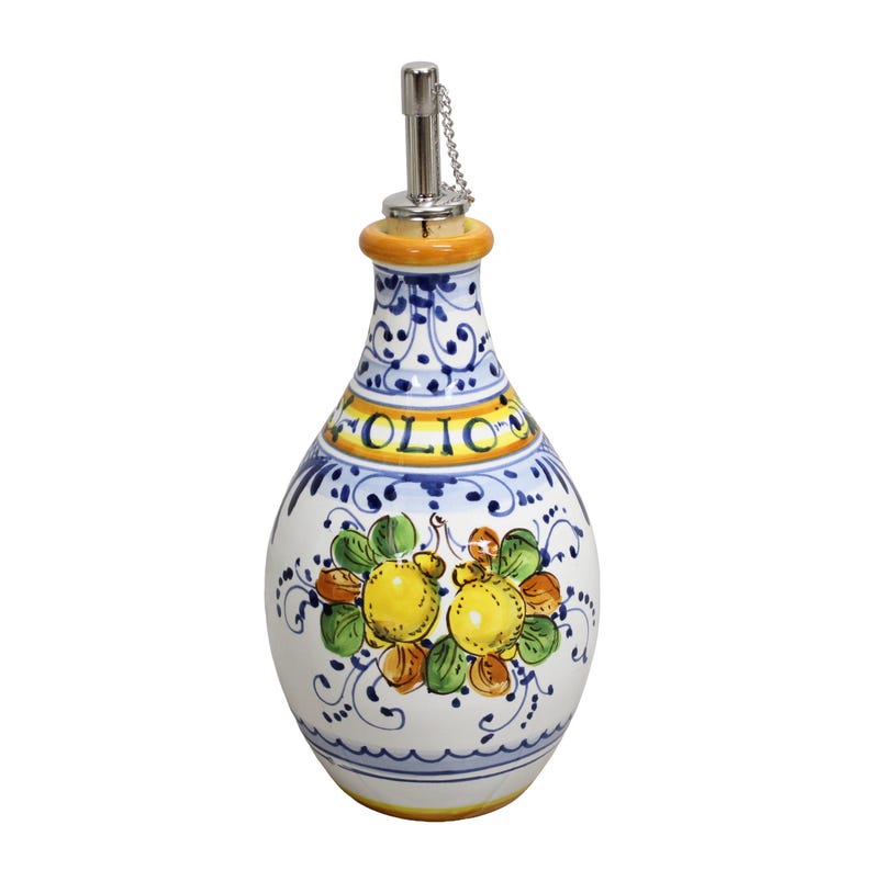 May include: White ceramic olive oil bottle with a decorative design. The bottle features a floral pattern with yellow lemons and green leaves. The word "OLIO" is written in yellow. It has a metal spout with a chain and a yellow and orange neck.