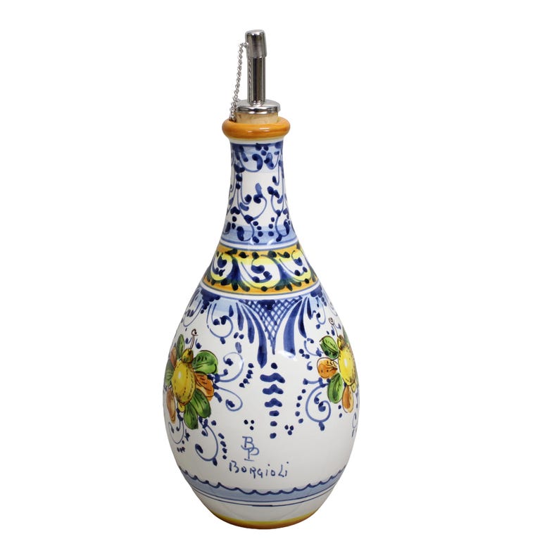 May include: A white ceramic oil bottle with a decorative floral design in yellow, green, and blue. The bottle has a silver spout and a cork-like top. The words "Borgioli" are written on the bottle.