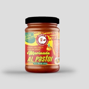 May include: A red glass jar with a black lid containing a marinade called "Al Pastor". The label is yellow and red with the text "Kuko's Michoacan Foods" and "Adobo Chili Paste Cooking Sauce". The jar is 16 ounces (453 grams).
