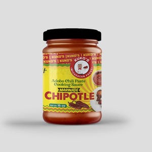 May include: A yellow and red label with the text "Kuko's Michoacan Foods" and "Adobo Chili Paste Cooking Sauce Marinade Chipotle" on a glass jar of red sauce. The jar is 16 ounces.