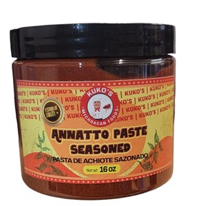 May include: A 16 ounce jar of Kuko's Annatto Paste Seasoned, a red paste with a yellow label. The label reads "Kuko's Michoacan Foods" and "Annatto Paste Seasoned" in bold, black letters. The label also reads "Pasta de Achiote Sazonado" in smaller, black letters.