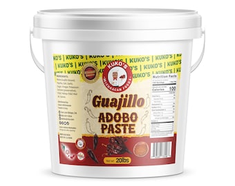 May include: A white plastic bucket with a yellow and red label. The label says "Kuko's Michoacan Foods" and "Guajillo Adobo Paste". The bucket contains 20 pounds of adobo paste.