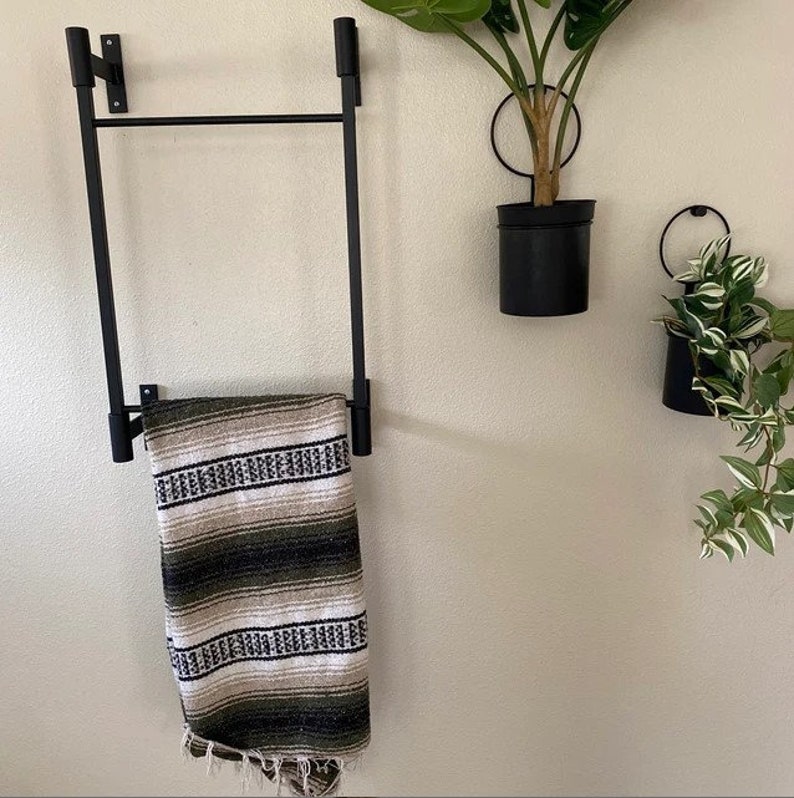 small wall mounted decorative ladder for hanging blankets