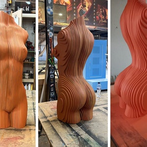 May include: A three-dimensional sculpture of a human torso made of layered wood. The sculpture is painted a bright orange color. The sculpture is shown in three different stages of completion.