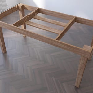 May include: A wooden table frame with four legs and a slatted design. The frame is made of unfinished wood and has a rectangular shape.