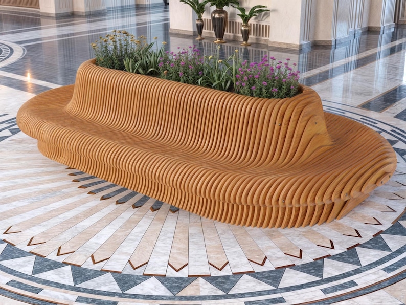 May include: A long, curved wooden bench with a planter built into the top. The bench is made of light brown wood and has a wavy, organic shape. The planter is filled with green plants and purple flowers.