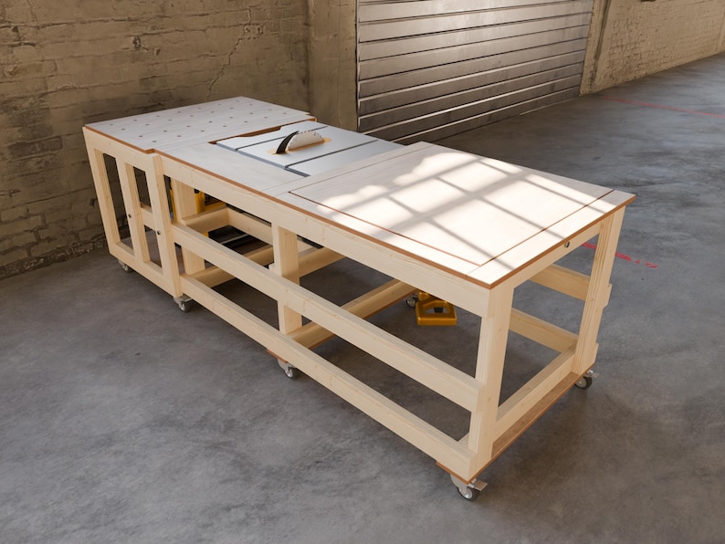 May include: A light-colored wooden workbench on casters featuring a built-in table saw with a blade guard. The top surface includes a grid of holes on one side and a flat, smooth panel on the other, supported by an open frame structure.
