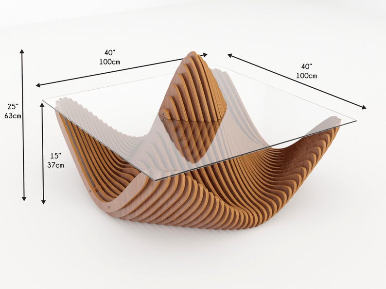 May include: A modern coffee table with a unique design. The table features a clear glass top supported by a wavy, layered wooden base. The table is 40 inches (100cm) wide, 25 inches (63cm) high, and 15 inches (37cm) deep.
