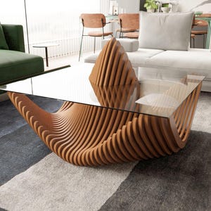 May include: A modern coffee table with a clear glass top and a unique base made of curved, light brown wooden slats. The table's design is sculptural and eye-catching, suitable for a contemporary living room setting.