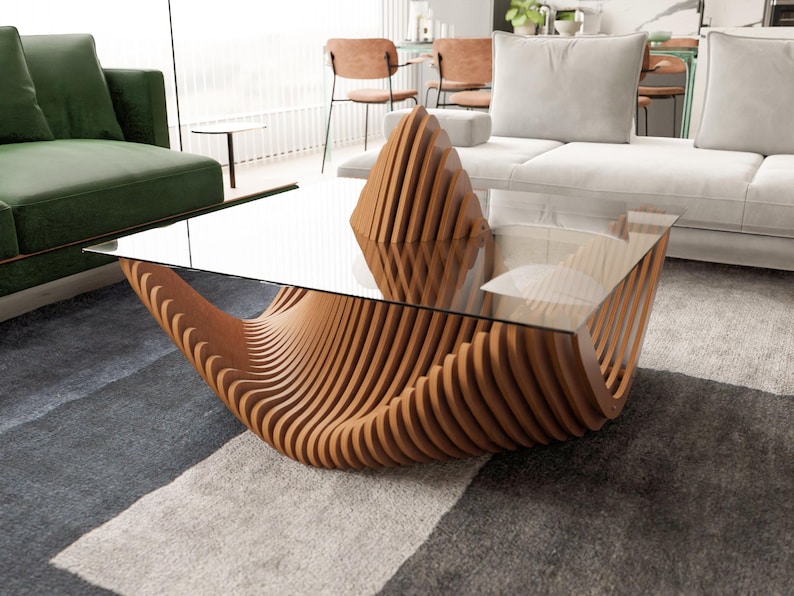 May include: A modern coffee table with a clear glass top and a unique base made of curved, light brown wooden slats. The table's design is sculptural and eye-catching, suitable for a contemporary living room setting.