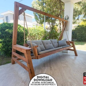 May include: A wooden swing with a gray cushioned seat and backrest. The swing is suspended from a wooden frame with rope supports. The frame is made of stained wood. The image also includes text that says "DIGITAL DOWNLOAD".