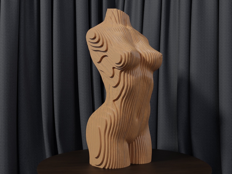 May include: A wooden sculpture of a human torso with a layered, geometric design. The sculpture is made of light brown wood and has a smooth, polished finish.