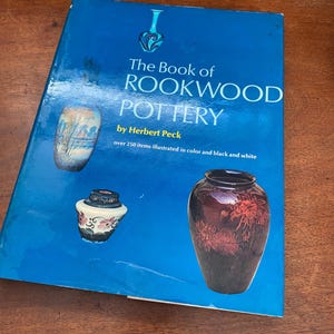 May include: A set of three ceramic mugs with a speckled, matte finish. Each mug features a different color: light blue, cream, and gray. The mugs have a simple, modern design and a comfortable handle.