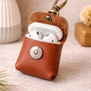 Hair on hide/ cowhide and leather keychain or bag charm  for AirPods or coins.