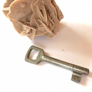 Antique door key, old metal key, aluminum key, gray door key